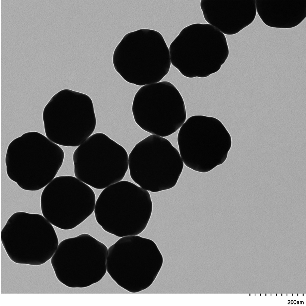 High magnification TEM image highlighting the smooth, spherical morphology of individual 200 nm gold nanoparticles